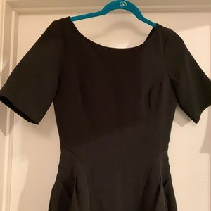 Black A-line short sleeve dress.
